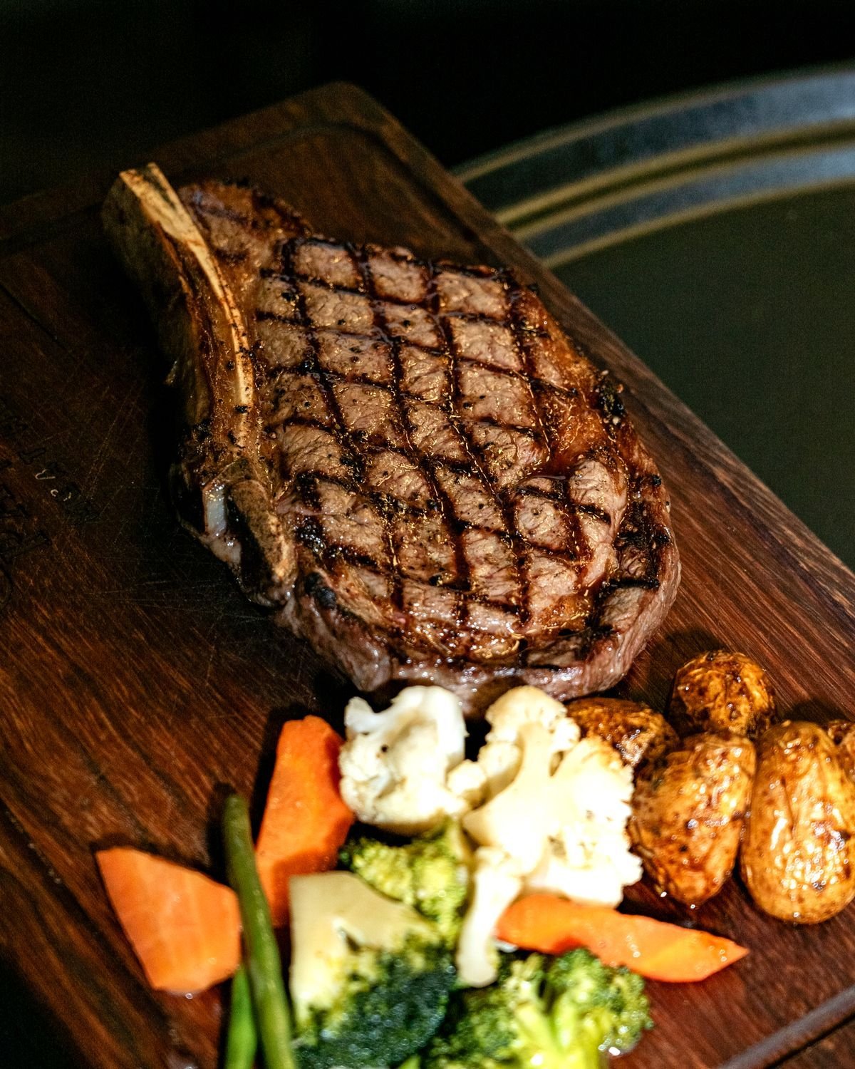 Cowboy Ribeye with Roasted Cauliflower and Carrots