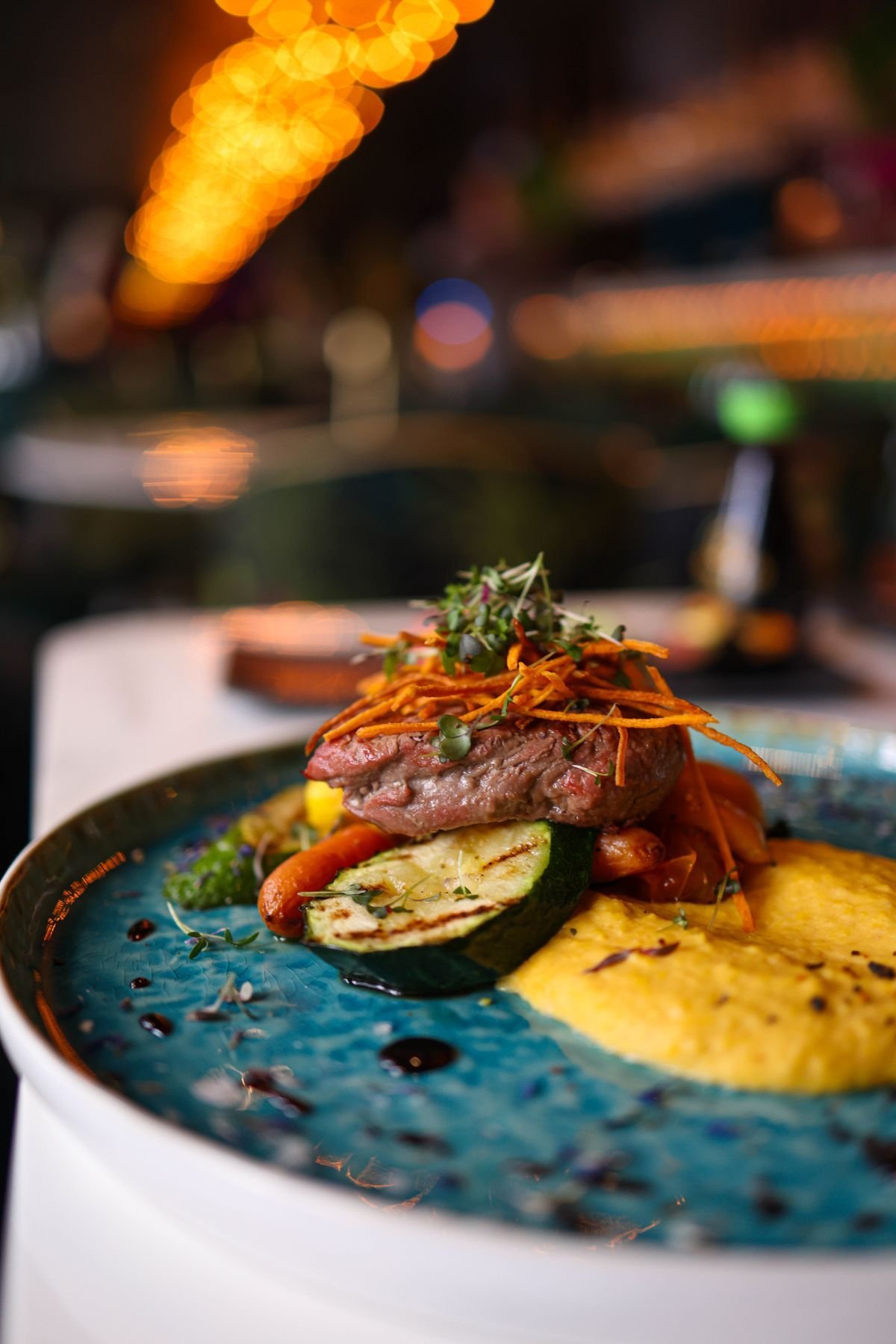 Denver Steak with Grilled Zucchini and Soft Polenta