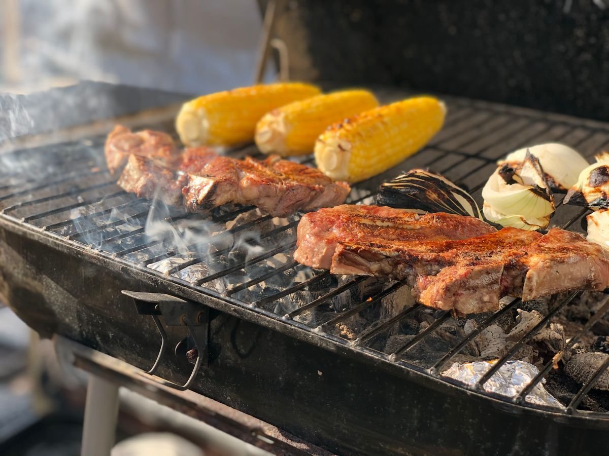 Grilled New York Strips with Charred Corn and Onions