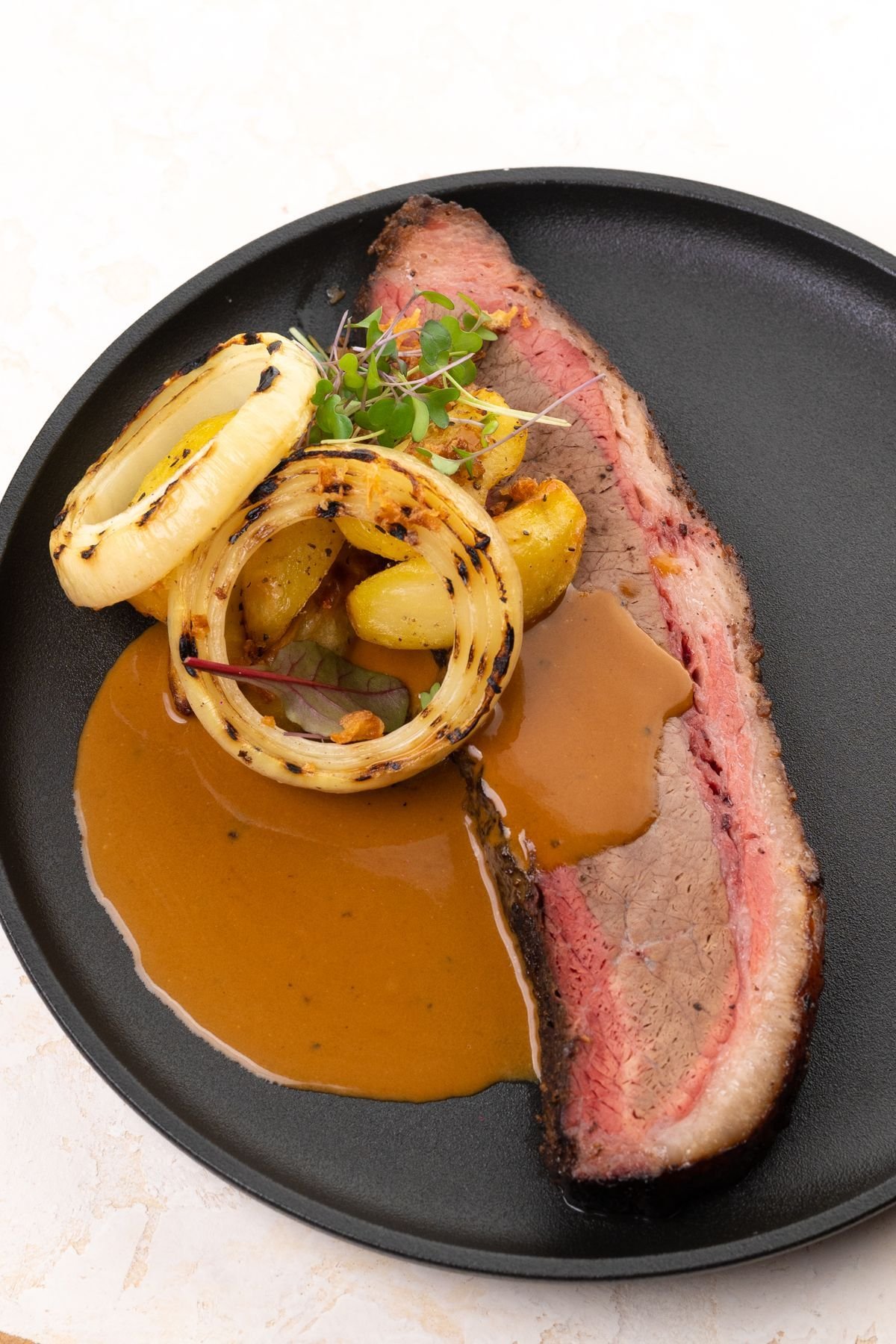 Oven-Finished Brisket with Charred Onion Jus
