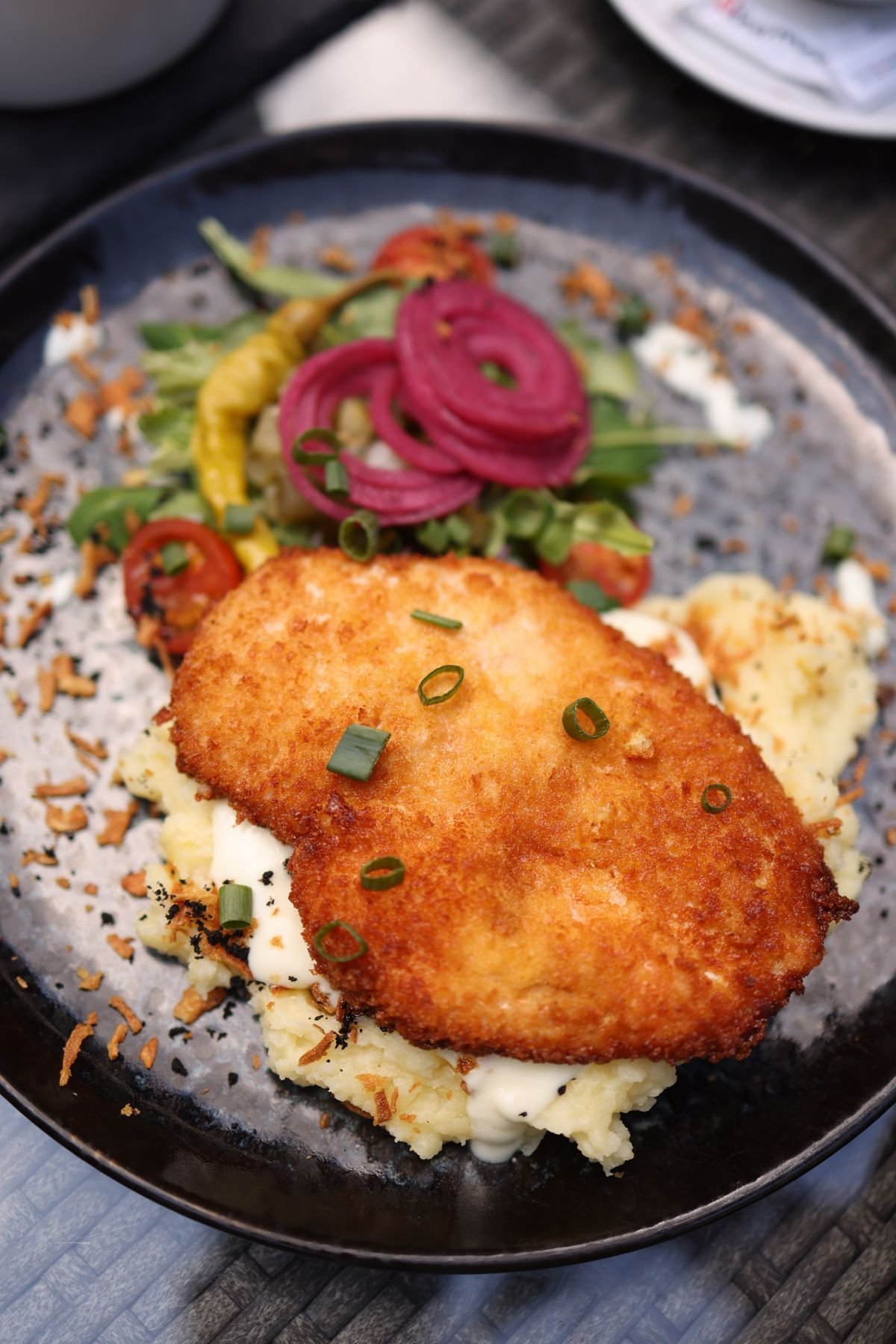 Pork Schnitzel over Mash with Pickled Red Onions