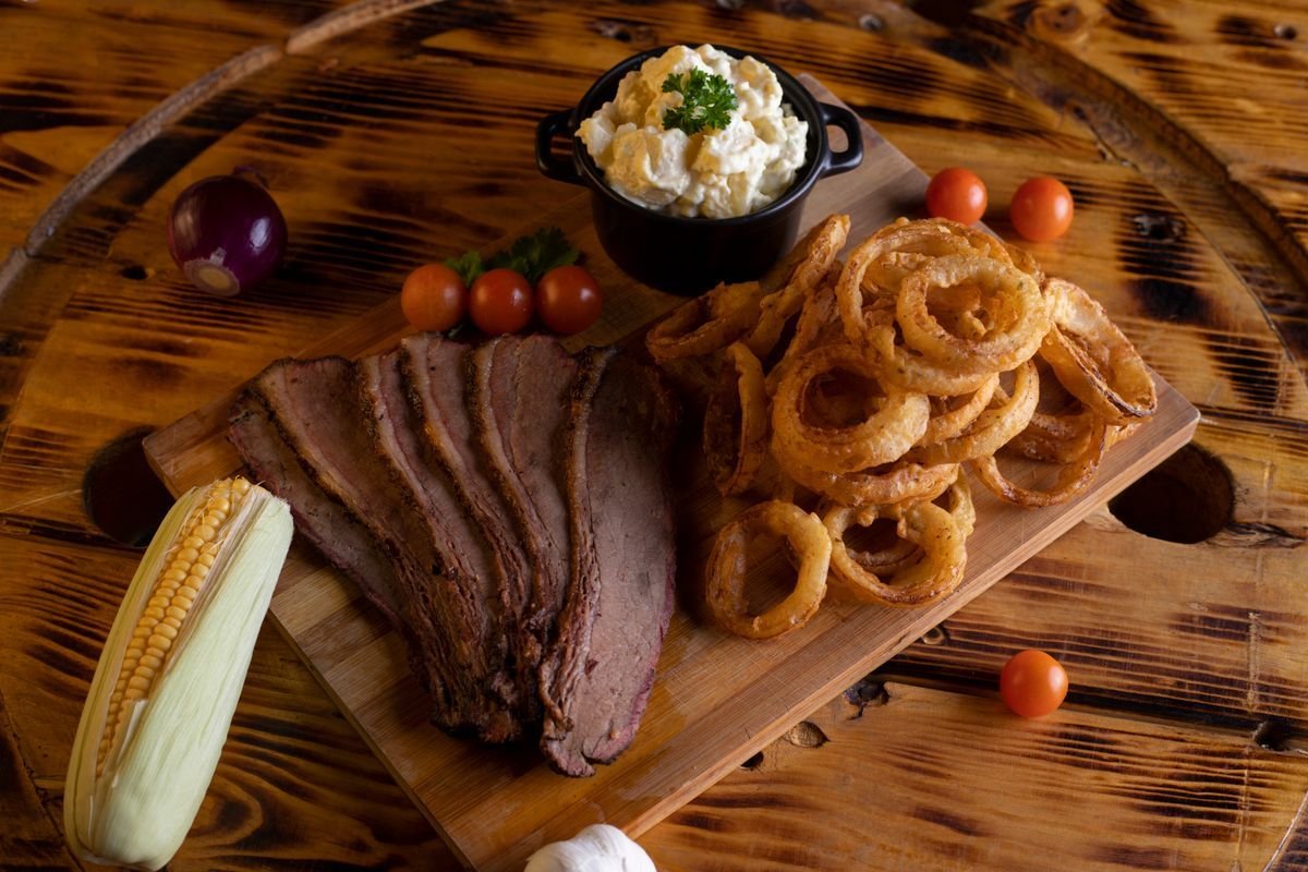 Smoked Brisket Point with Onion Rings and Corn